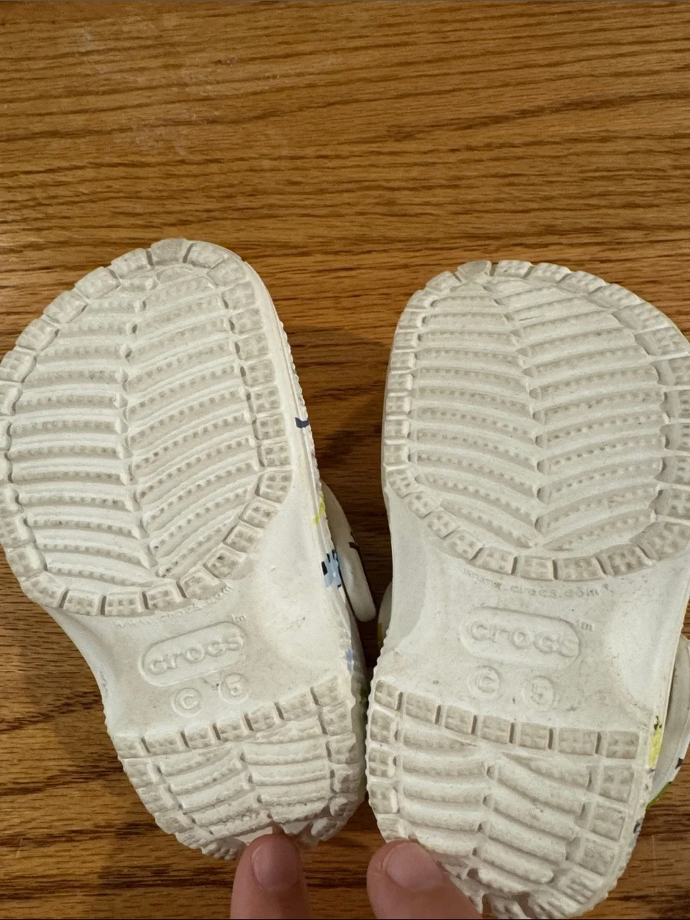 CROCS Kids White Clogs with Green, Blue & Yellow Dino Print